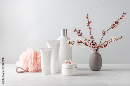 Cuadro en lienzo Set of cosmetics, washcloth and a bouquet of flowers. Copy space.
