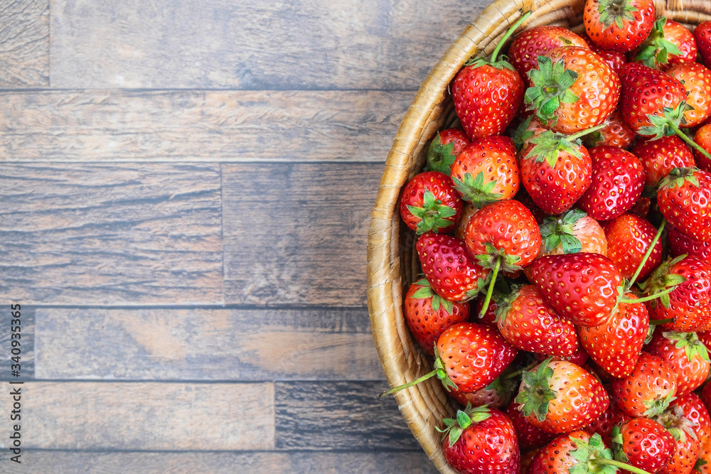 Fresh strawberry fruit in a basket, Top view