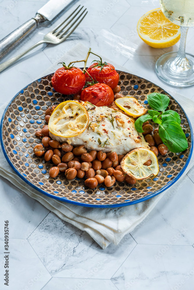 Halibut baked in white wine with borlotti beans and tomatoes