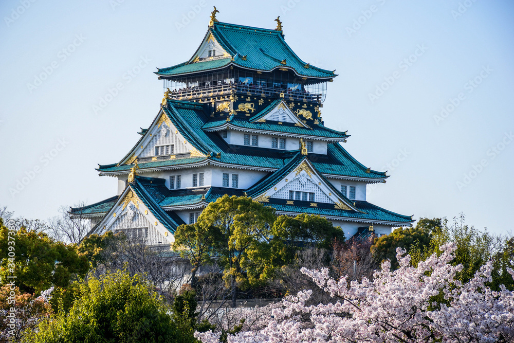 Majestic blue roof Osaka castle with rich decoration in Japan Majestic blue roof Osaka castle with rich decoration in Japan