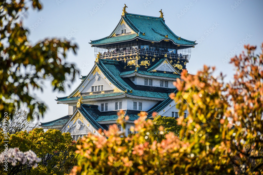 The most nice japanese castle is in Osaka, blue roof and beautiful surrounding The most nice japanese castle is in Osaka, blue roof and beautiful surrounding
