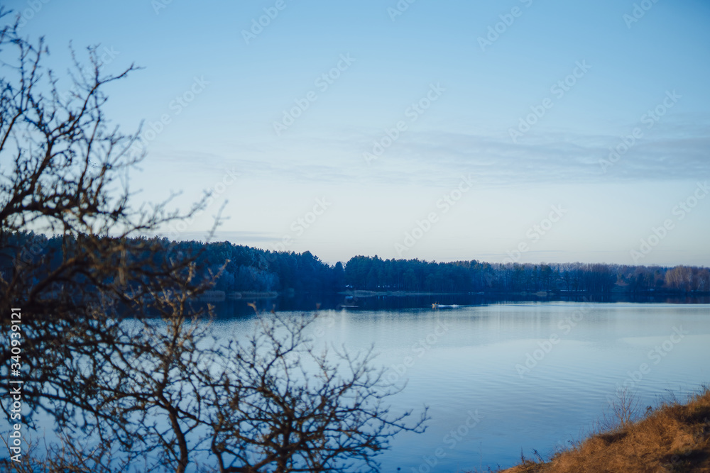 Lovely beautiful blue river. Calm landscape with river and lue sky.