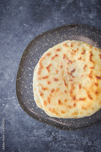 Khychin, Tortilla, Traditional Balkar food, Ossetian pie, Dark background photo
