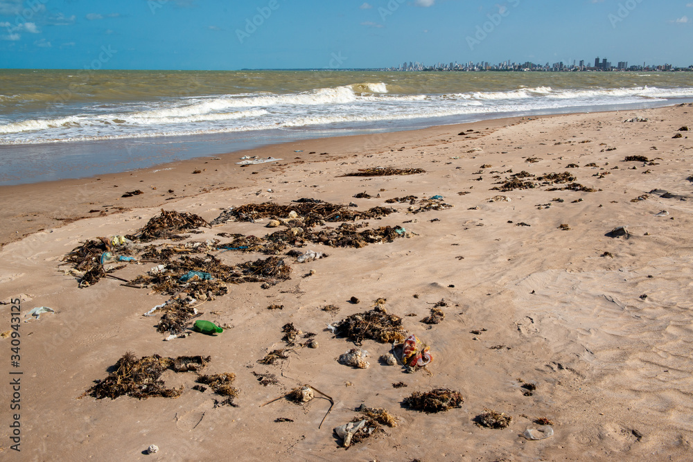 Beach sand with remains of plastic and garbage in João Pessoa, Paraíba, Brazil on September 29, 2012 Beach sand with remains of plastic and garbage in João Pessoa, Paraíba, Brazil on September 29, 2012