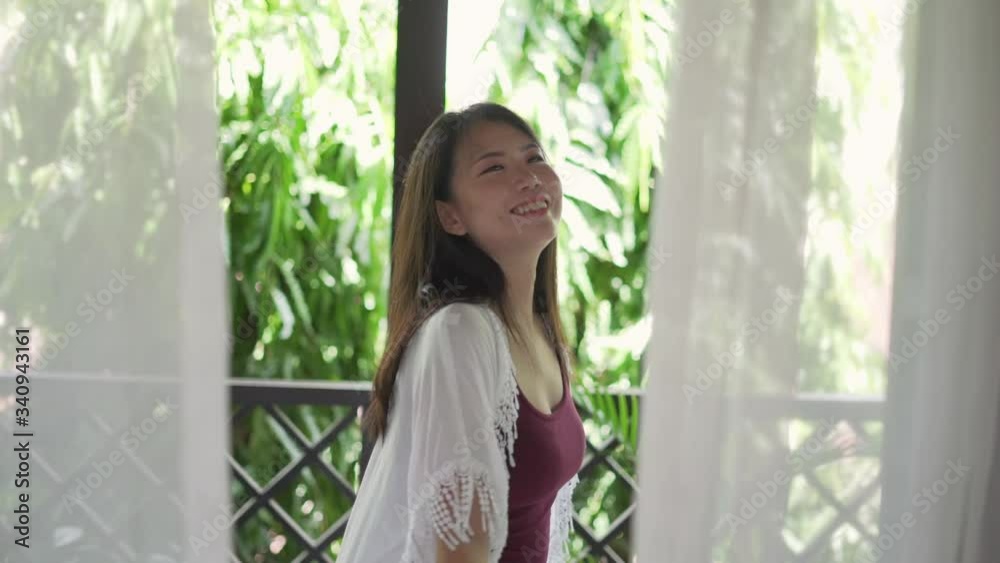 slow motion lifestyle tracking gimbal shot on young beautiful and happy Asian woman enjoying at hotel terrace or home balcony smiling relaxed and cheerful in wellness
slow motion lifestyle tracking gimbal shot on young beautiful and happy Asian woman enjoying at hotel terrace or home balcony smiling relaxed and cheerful in wellness