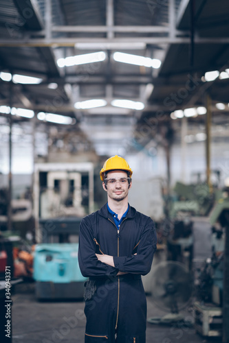 wroker technician engineer standing in factory