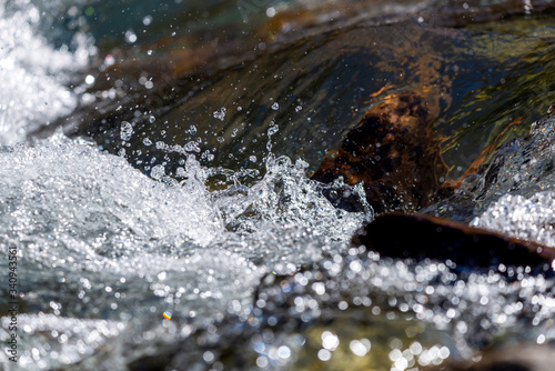 Water mountain river and the wonderful rocky creek. Water Drops after splash. Closeup macro view