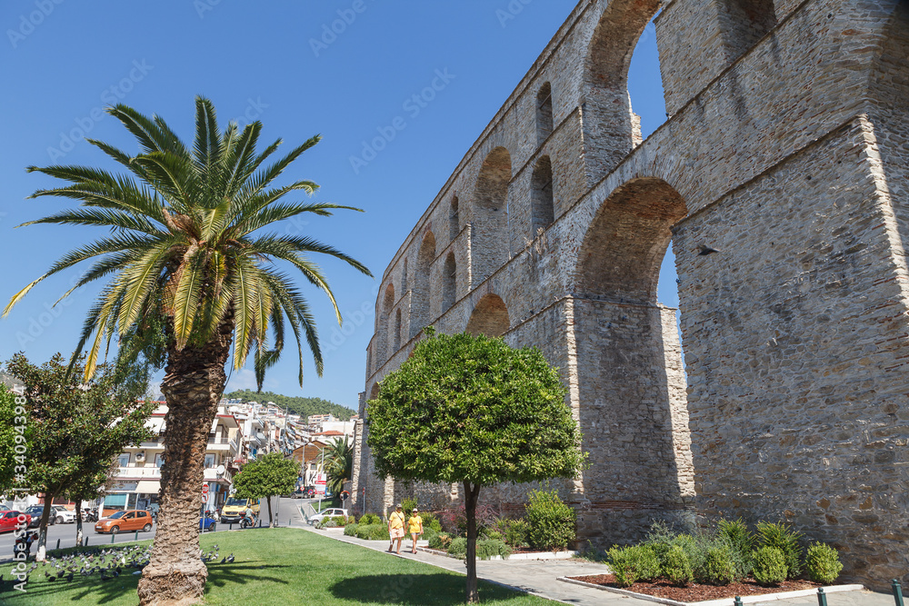 Medieval aqueduct Kamares in the Kavala city. Sunny summer day in the Macedonia, Greece, Europe.