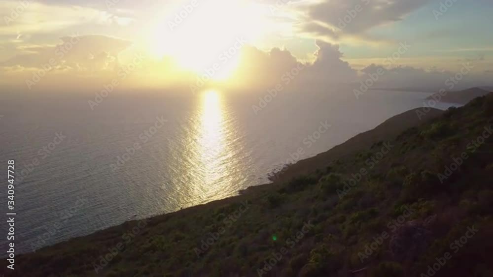 Aerial view of a sea mountain landscape at sunset with happy family and dog Aerial view of a sea mountain landscape at sunset with happy family and dog