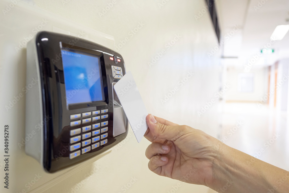 Fototapeta premium Hand to use key card open automatic access security door control