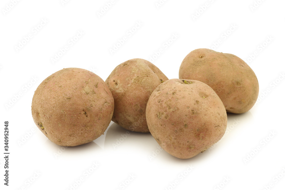 Freshly harvested potatoes on a white background Freshly harvested potatoes on a white background