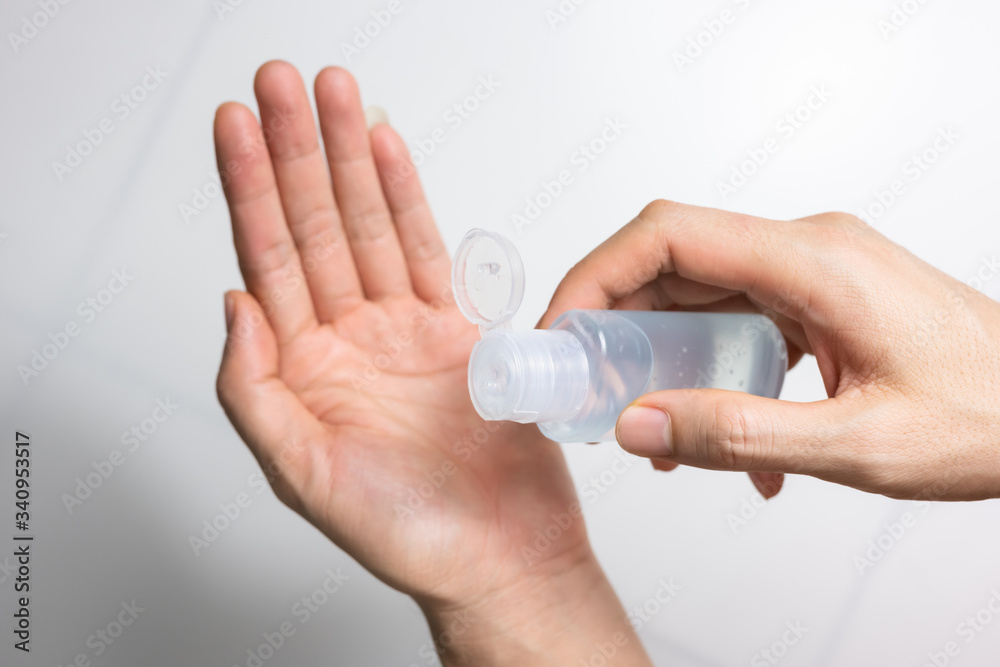 Man using alcohol gel, hand sanitizer gel for protection coronavirus disease (covid-19) and germ (select focus) Man using alcohol gel, hand sanitizer gel for protection coronavirus disease (covid-19) and germ (select focus)