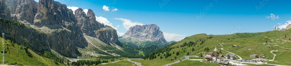 Panoramic view of valley of Passo Gardena toward Selva Wolfenstein, Dolomites, South Tyrol, Italy, Europe
