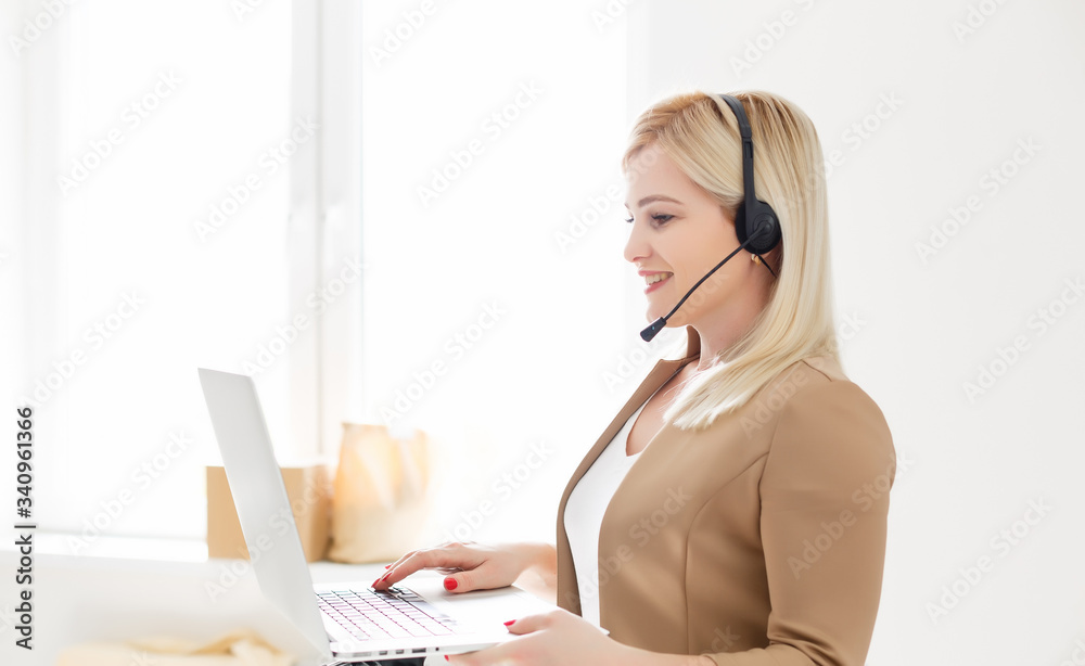 Cheerful woman wear headset laugh using laptop video stream conference call teach online, happy ethnic girl student gamer tutor have fun watch webinar web cam education entertainment concept Cheerful woman wear headset laugh using laptop video stream conference call teach online, happy ethnic girl student gamer tutor have fun watch webinar web cam education entertainment concept