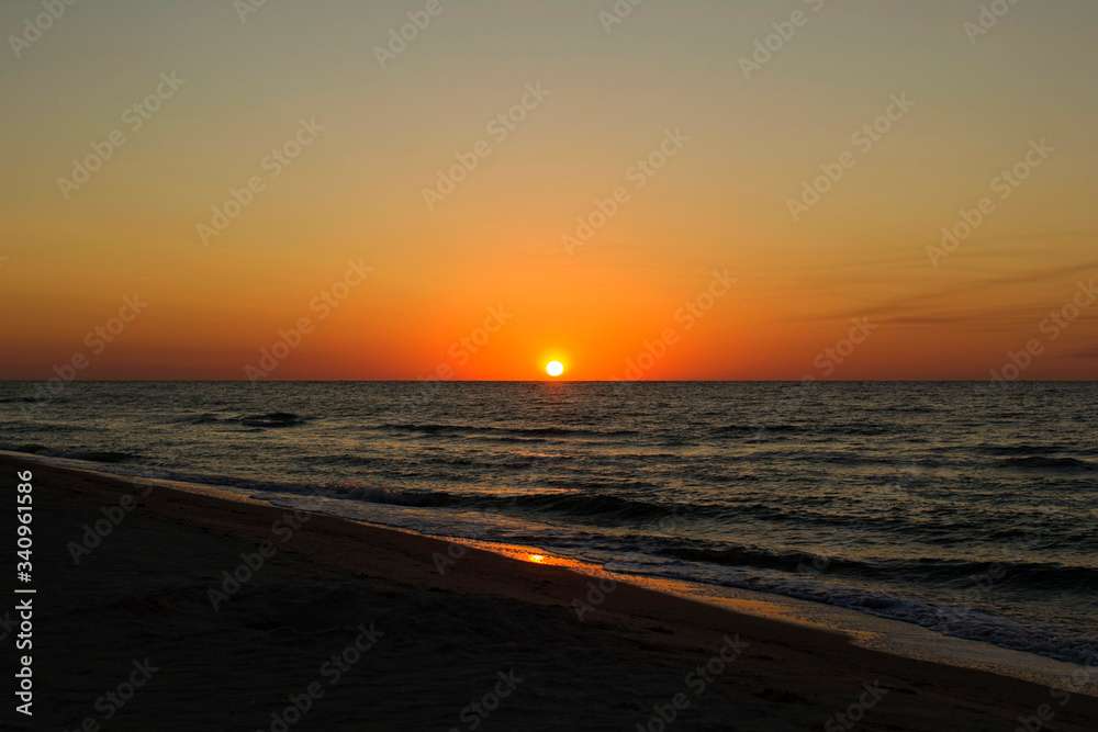 Picture of beautiful sunset or sunrise at calm seaside