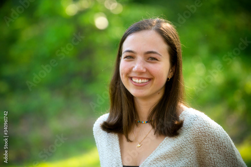 Fotografie Outdoor portrait of attractive college age young woman