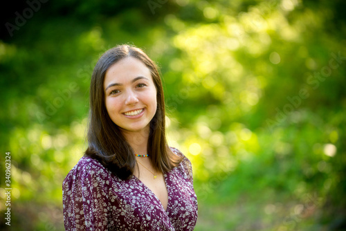 Outdoor portrait of attractive college age young woman