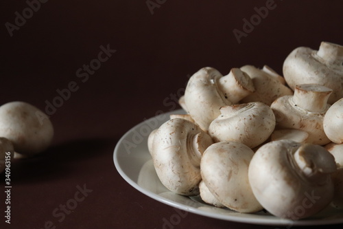 mushrooms on a plate on dark brown background
