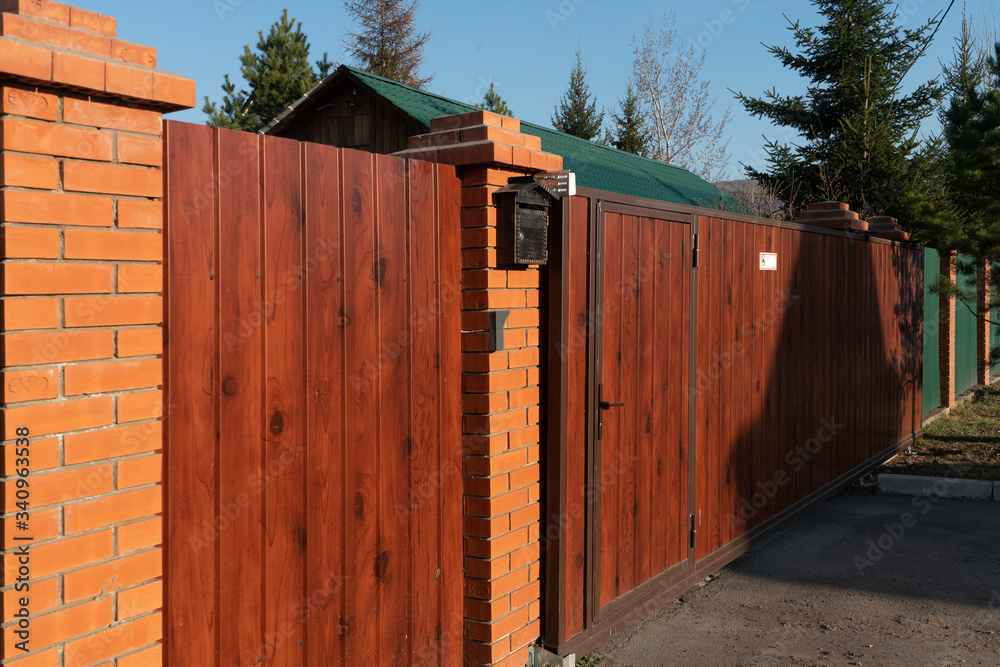Wooden gate to a country house.