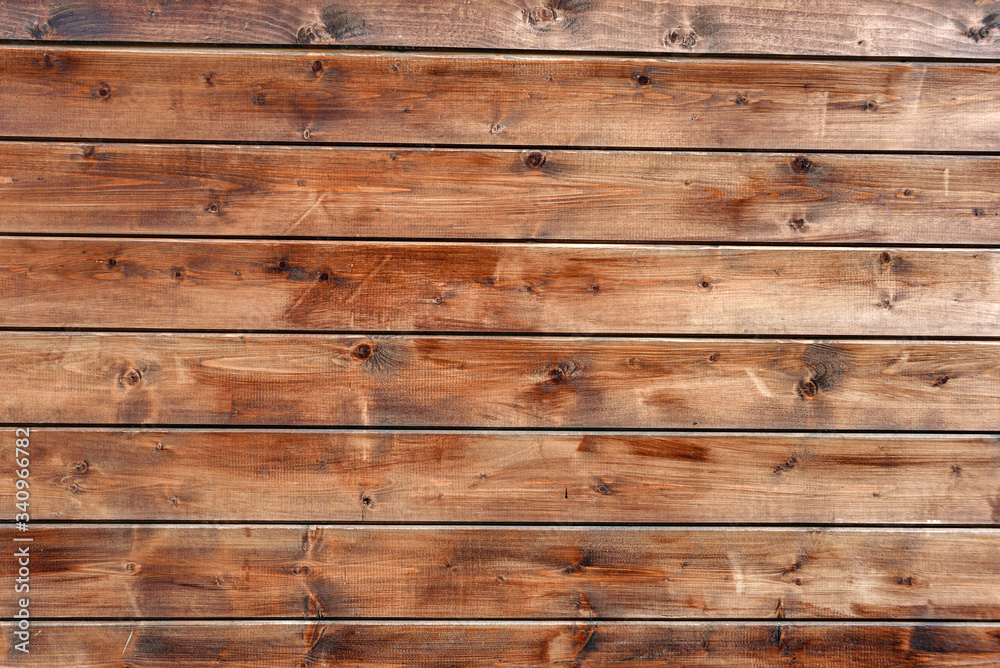 Obraz premium The surface is made of parallel boards. The texture of the processed wood.