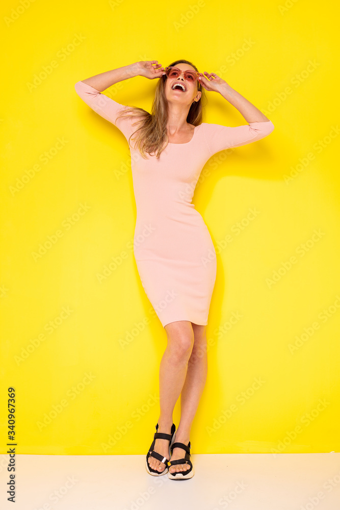 Fototapeta premium young and elegant on yellow