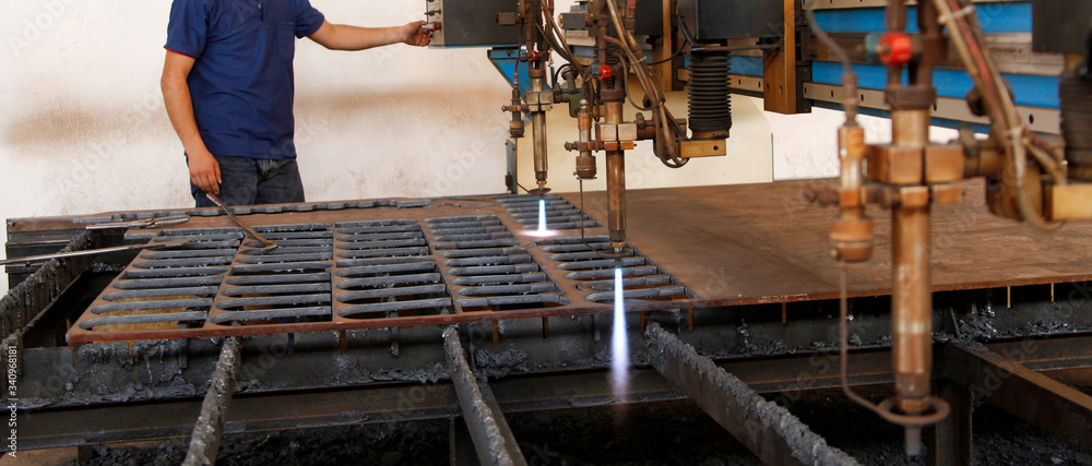 CNC laser cutting metal sheet.
