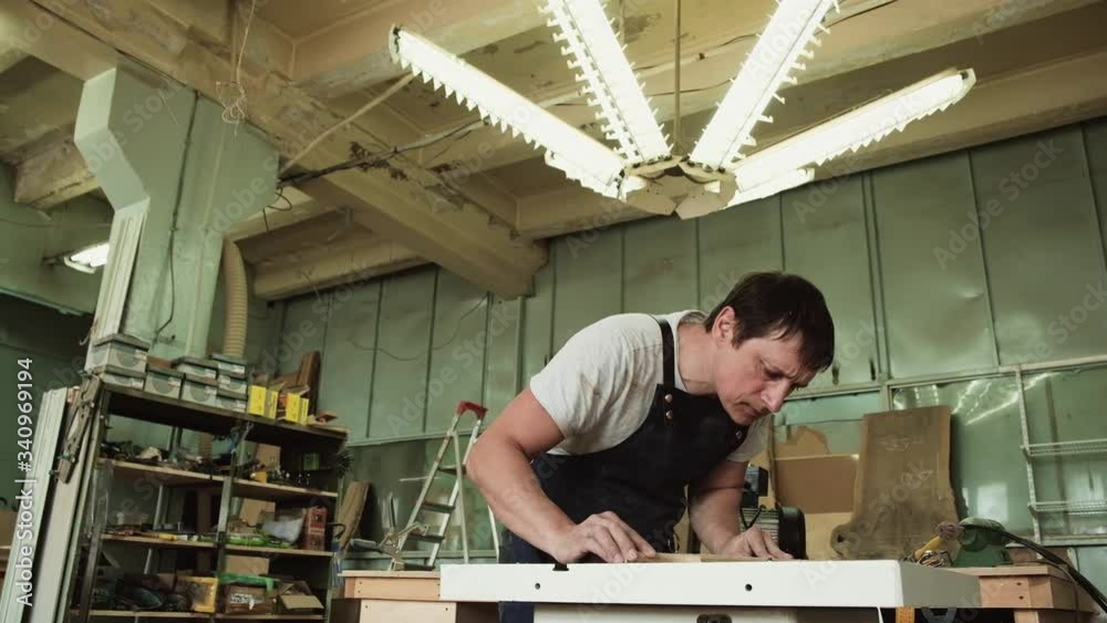 Craft woodwork. Craftman milling wooden furniture. Equipment in workshop. Craft woodwork. Craftman milling wooden furniture. Equipment in workshop.