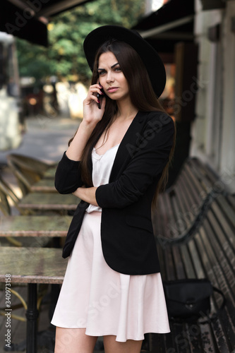 A woman talking on a cell phone. High quality photo