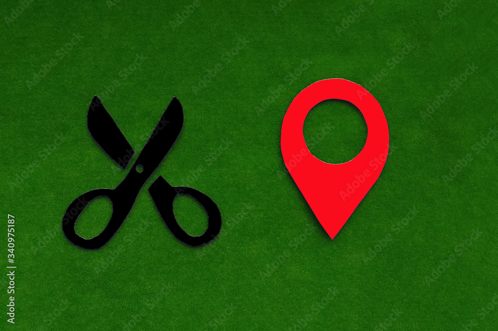 Scissors, geolocation sign on a green background. Location of the Barber's services.