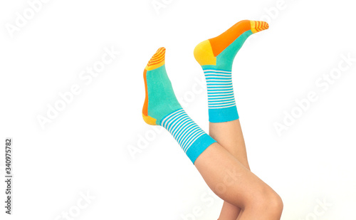 Woman in stylish socks on white background