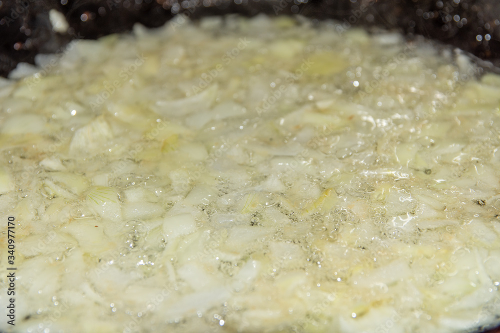Finely chopped onion fried in a pan. Finely chopped onion fried in a pan.