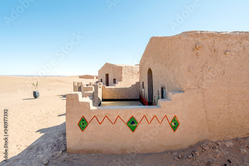 Traditional mus houses built on Sahara desert in Morocco photo