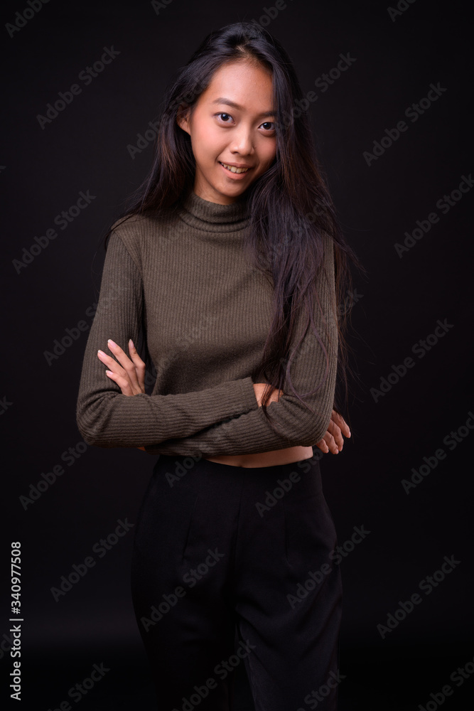 Portrait of happy young beautiful Asian woman Portrait of happy young beautiful Asian woman