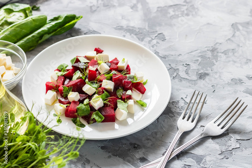 Baked beets with feta cheese and shoots of young peas