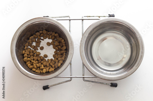 cat food bowl, chrome dishes, leftover food, white background