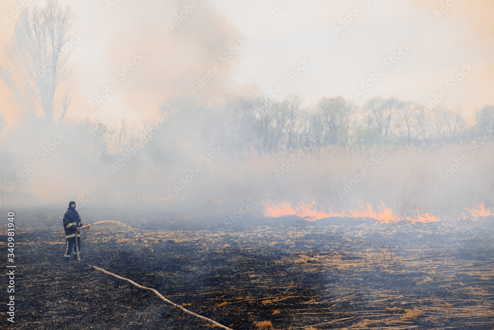Firefighters battle a wildfire. Ecological disaster concept. Australia. Brazil.