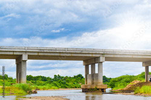 The bridge in countryside, View of bridge on blue sky © piti