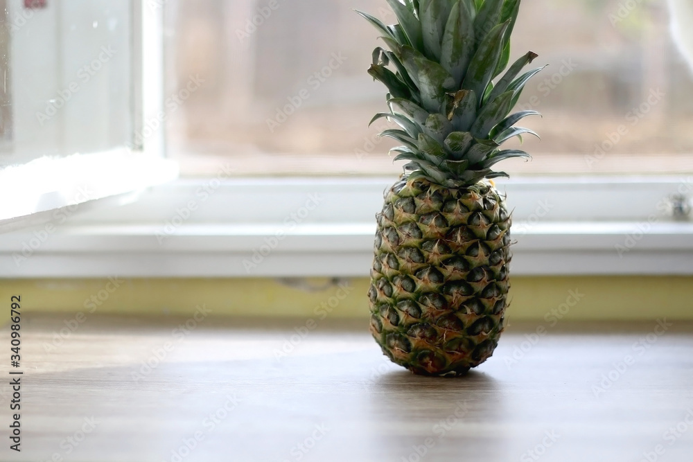 Fresh pineapple on a table. Selective focus. Fresh pineapple on a table. Selective focus.