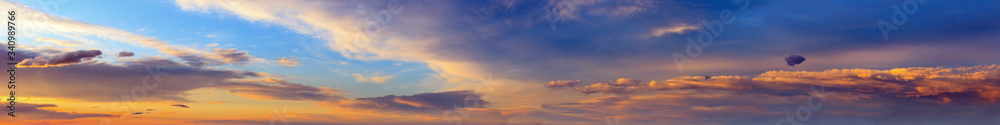 Sunset sky panorama with clouds