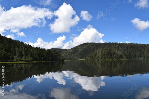 Scenic View Of Calm Lake Against Mountain Range © xinhua yang/EyeEm