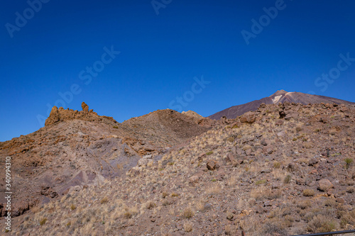 Volcanic rocks in the hills of Tenerife with clear blue skies