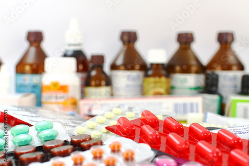 Medical still life Medical preparations with tablets, capsules, alcohol, hydrogen peroxide, thermometer, vitamins, iodine, packages with medicines