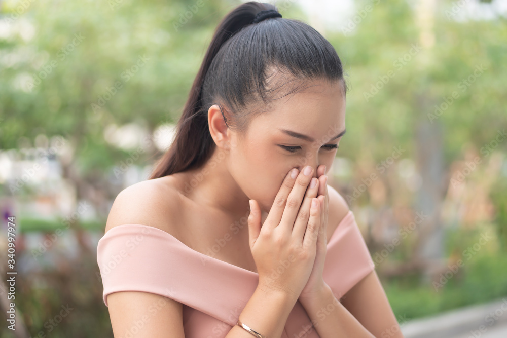 sick woman sneezing with sore throat; sick woman with allergic sneeze symptom, sore throat, cold, flu, contagious virus disease, coronavirus, allergy, health care concept; young adult woman model sick woman sneezing with sore throat; sick woman with allergic sneeze symptom, sore throat, cold, flu, contagious virus disease, coronavirus, allergy, health care concept; young adult woman model