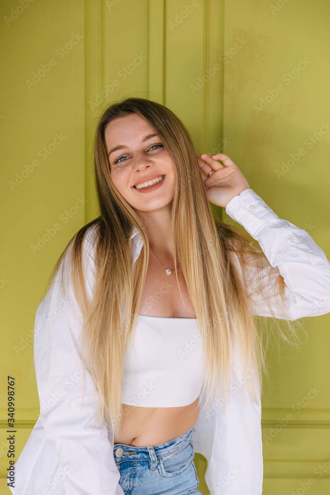 Style and fashion. Indoor shot of cheerful smiling young woman o Style and fashion. Indoor shot of cheerful smiling young woman o