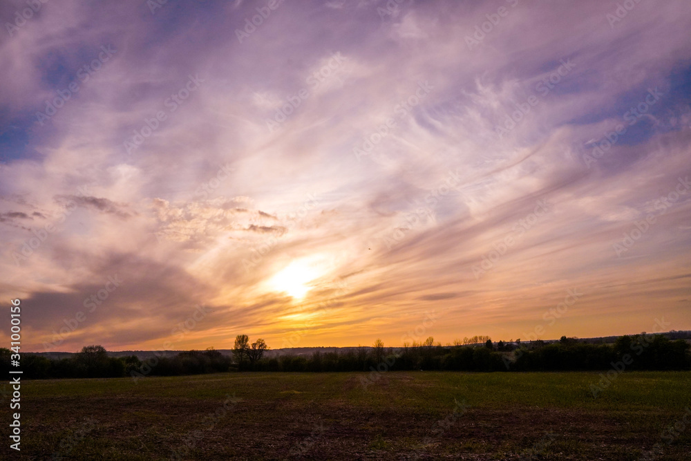 Fototapeta premium sunset over the field