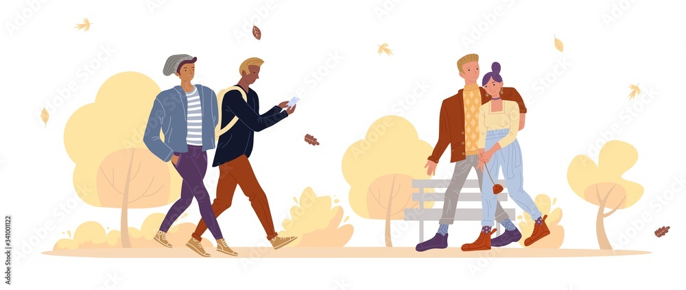 Young multiethnic people in fall park. Boyfriend hugging girlfriend going together. Romantic dating. Teenager boy student walking communicating networking via smartphone. Autumn natural background