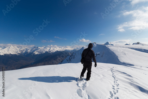A man in mountain day winter