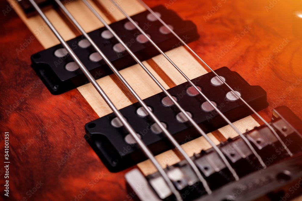 Fototapeta premium Brown Electric Bass Guitar. Close Up. Abstract Picture