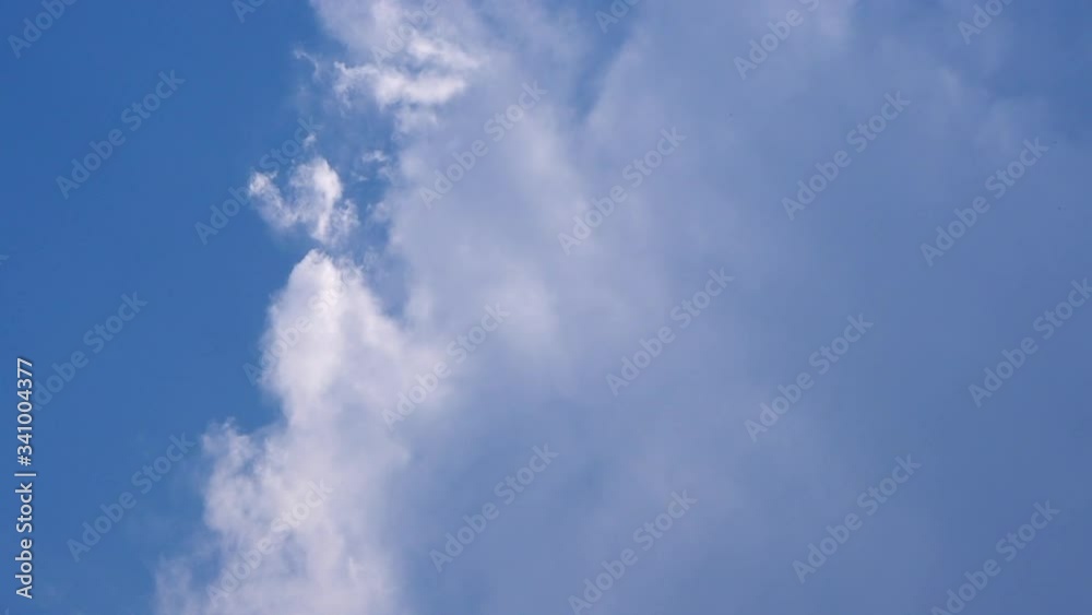 Blue sky and fuffy stratocumulus clouds are in day day just before rain. the weather appeared half cloudy than sunny. Blue sky and fuffy stratocumulus clouds are in day day just before rain. the weather appeared half cloudy than sunny.