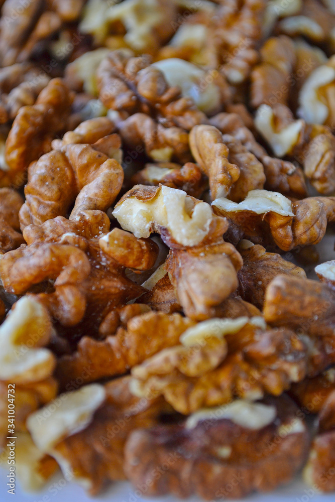 Walnuts on a white wooden background. Walnuts on a white wooden background.